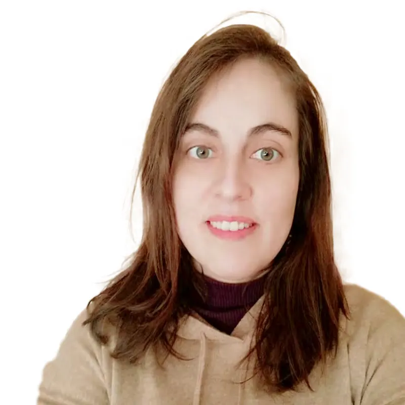 Portrait of Cecilia Domínguez, with long brown hair, wearing a sand-coloured sweatshirt.