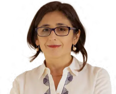 Portrait of Andrea Osorio, wearing glasses and an embroidered white blouse.
