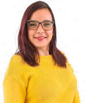 Portrait of Ruth Castillo, wearing glasses and a yellow sweater.